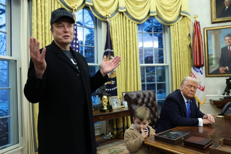 Elon Musk speaking at a press conference during his time in the Trump administration