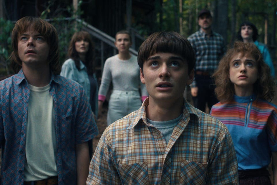 Stranger Things cast on 1980s-themed set at Tudum event